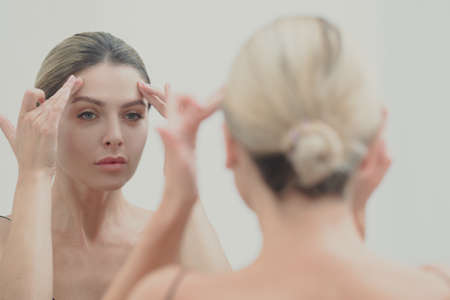 Natural beauty and skincare concept. Portrait of beautiful female model with clean face, isolated...