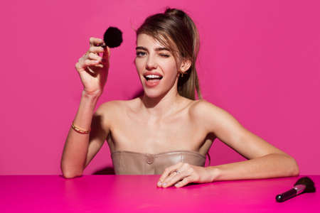 Sexy makeup for party. Beautiful sensual young woman with makeup blusher brush, sexy make up,...