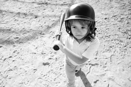 Child playing Baseball. Batter in youth league getting a hit. Boy kid hitting a baseball.