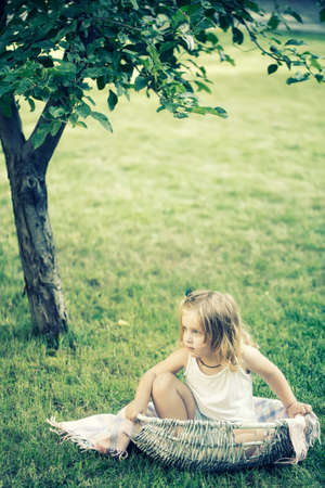Happy baby having fun at the park. Funny baby child. Children on pirnic.の写真素材