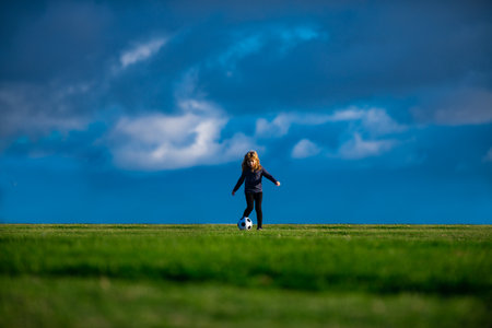 Kid playing soccer, happy child enjoying sports football game, kids activities, little soccer...