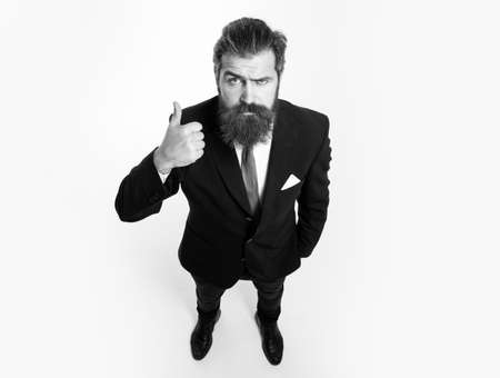 Business man showing thumbs up, copy space. Wide angle, top view.の写真素材