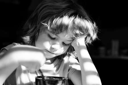 Kids food concept. Child having breakfast at home. Healthy homefood. Boy eats at kitchen.