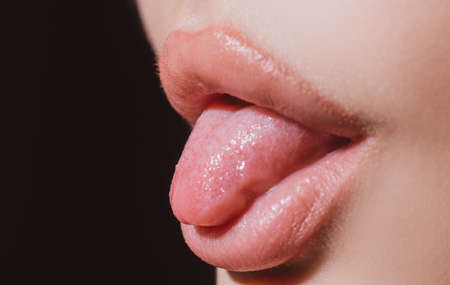 Red lips, mouth and tongue icon. Poster and banner of open mouth. Close-up woman licking lips....