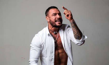 Emotional angry man, upset guy. Screaming, hate, rage. Pensive man feeling furious mad and crazy stress.の写真素材