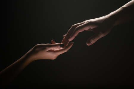 Hands at the time of rescue. Friendly handshake, friends greeting, teamwork, friendship. Tenderness,...