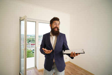 Moving day. Real estate agent with clipboard.の写真素材