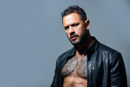 Portrait of serious man. Brutal angry gang man lifestyle, handsome guy. Close up portrait of guy...