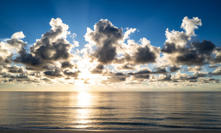 Sunset sea landscape. Colorful beach sunrise with calm waves. Nature sea sky. range and golden...