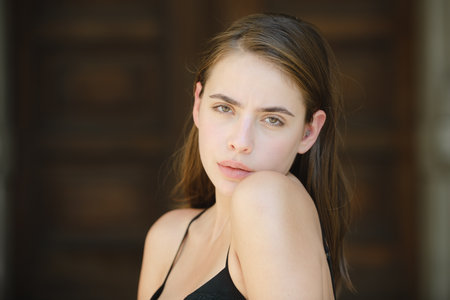 Beautiful girl face closeup, outside portrait of young woman. Summer romantic casual woman.の写真素材