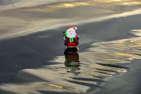 New Year travel. Toy summer Santa. Christmas banner, poster or greeting cards.の写真素材