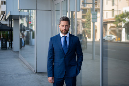 Manager in a luxury modern open space business center. Successful business man outside.