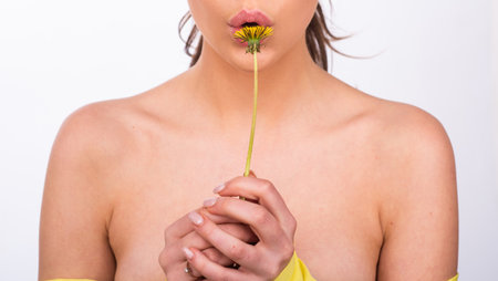 Spring girl with dandelion flower. Enjoy Nature. Allergy free concept.の写真素材