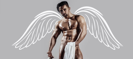 Naked muscular angel. Photo banner of sexy man with wings for valentines day. Sexy male model body, nude torso. Sexy naked man, seductive gay. Muscular shirtless man, attractive guy.の写真素材