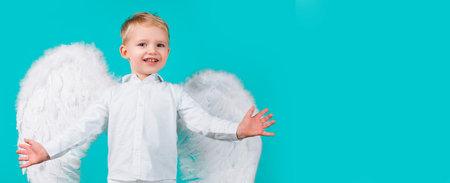 Valentines day banner with angel child. Beautiful little angel child boy with smile.の写真素材