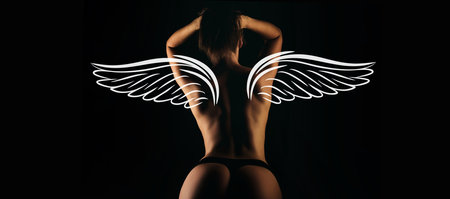 Sexy angel with wings. Valentines day wide photo banner for website header design. Nude woman back. Beautiful ass of young woman over dark background.の写真素材