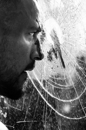 Blood stain at smashed window glass. Mens power and strength. Mens style and fashion concept. Strong...