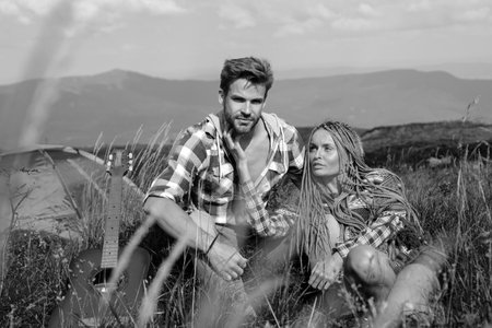 Summer couple camping. Weekend hike. People enjoying picnic on summer day. Love.