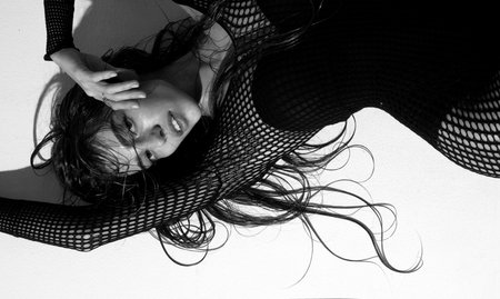 Sensual fashion model. Fashionable woman on isolated studio background. High fashion portrait of...