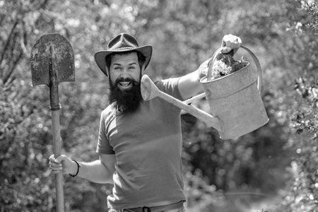 Crazy Farmer with Shovel and watering can. Garden man with tools.