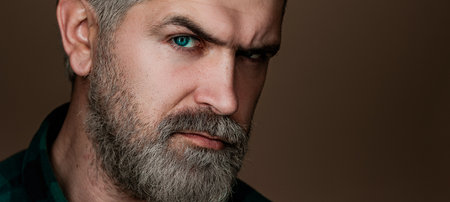 Professional model and professional photo shoot. Head and shoulders portrait of a bearded...