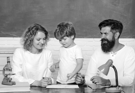 School family. Education. Kids at preschool. Child from elementary school with parents in school....