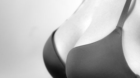 Photo of attractive shocked perfect beauty wavy lady bright lipstick arms hold unbelievable big breast amazing bra push up effect wear brassiere isolated.の写真素材