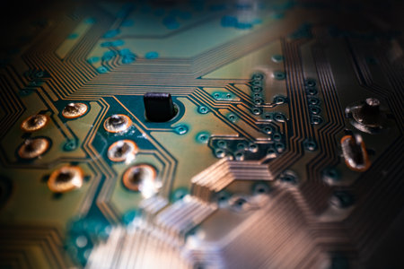 Electronic circuit board closeup. Electronic motherboard card. Circuitry and close-up on electronics. Background of electronics on board electrical circuits, technology texture.の写真素材