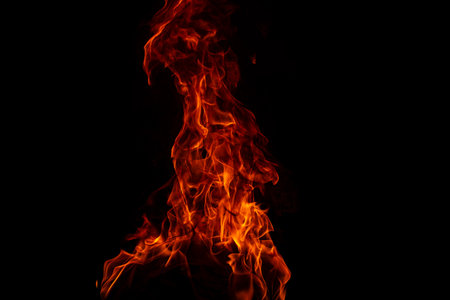 Fire blaze flames on black background. Fire burn flame isolated, abstract texture. Flaming explosion with burning effect. Fire wallpaper, abstract art pattern.の写真素材