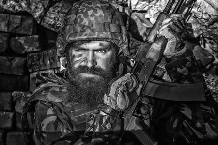 Russian or ukrainian soldiers with rifle. Russia vs Ukraine soldier. Ukraine war. Military conflict, geopolitical concept.の写真素材