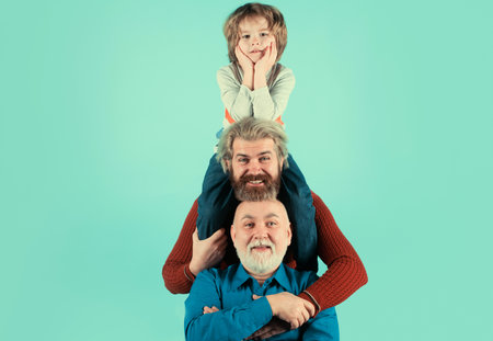 Generation of people and stages of growing up, isolated. Men generation grandfather father and grandson outdoor. Fathers day concept. Men in different ages.の写真素材