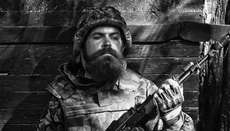 Close up portrait face of ukrainian soldier in army. Russian military forces, military game.の写真素材