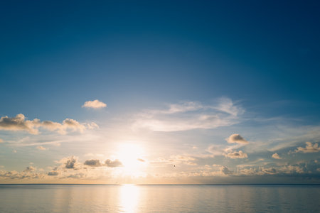 Sunrise sea on tropical beach background. Landscape of beautiful beach. Beautiful sunset at sea. Ocean sunset on sky background with colorful clouds. Vacation travel holiday banner.の写真素材