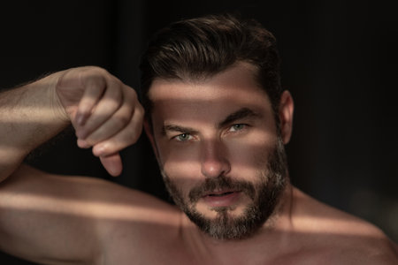Beautiful man with clean perfect skin. Beauty male skin care. Cosmetology cosmetics beauty and spa. Male facial treatment and wellness. Male coscmetic and beauty concept. Face care, male cosmetics.の写真素材