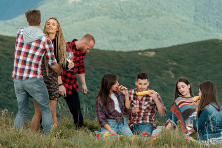 Group of people friends enjoy outdoor lifestyle activity in nature hiking and camping together on the mountain.の写真素材