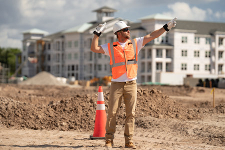 Construction worker with hardhat helmet on construction site. Construction engineer worker in...