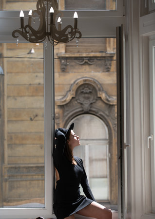 Fashion woman in luxury apartment. Beautiful elegant sexy model. Sensual beautiful woman face.