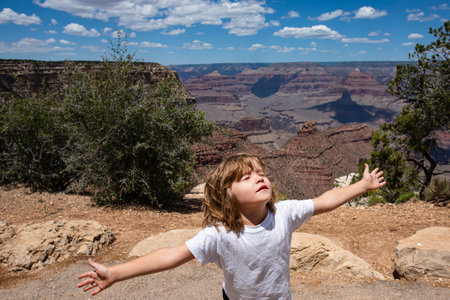 Outdoor close up portrait of a cute little child raised hands rest, relax outdoor. Portrait of...