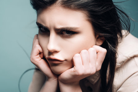 Sad angry beautiful woman, close up female face beauty portrait.の写真素材