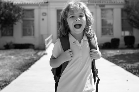 Amazed schoolchild running at end of class. School vocation.