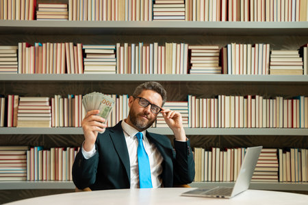 Portrait business man holding cash dollar bills in office. Big luck, banner. Dollar cash money...