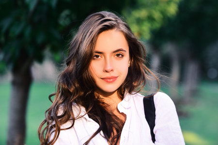 University female student outdoor. Smiling girl portrait,の写真素材
