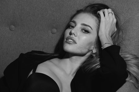 Beautiful Girl. Fashion model. Elegant woman wearing fashion dress in studio. Beautiful girl wear fashion clothes casual dress, vogue style.の写真素材