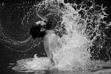 Man splashing water by hair. Carefree and positive thinking.