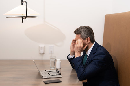 Head pain medicines pills concept. Headache and migraine. Man with sinus headache, tension or...