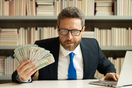 Business man with money banknotes. Male entrepreneur with dollar bills. Lucky boss, insurance agent, manager. Freelancer with cash. Boss, director owner concept. Money for small business.の写真素材