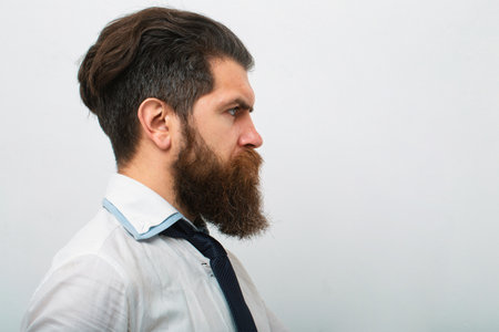 Business man in shirt and tie holding note pad and pen. Close up profile of surious man. Idea....