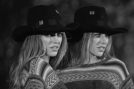 Portrait of a young woman in fashion hat , close up face of beautiful woman outdoor. Cheerful female model.の写真素材