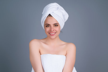 Facial treatment. Young woman with clean fresh skin. Beauty portrait of young women with beautiful face, young elegant girl. Portrait of female model in studio. Cosmetology and makeup.の写真素材