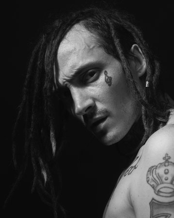 Portrait of handsome hippie, hipster man with serious face.の写真素材